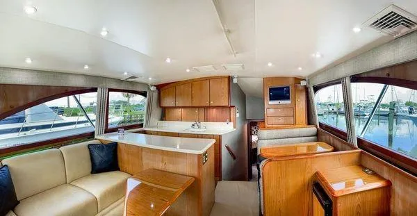 Slide: The Image of Luxurious interior of 2008 Ocean Yachts 46SS with elegant wood finishes and spacious seating. - 8