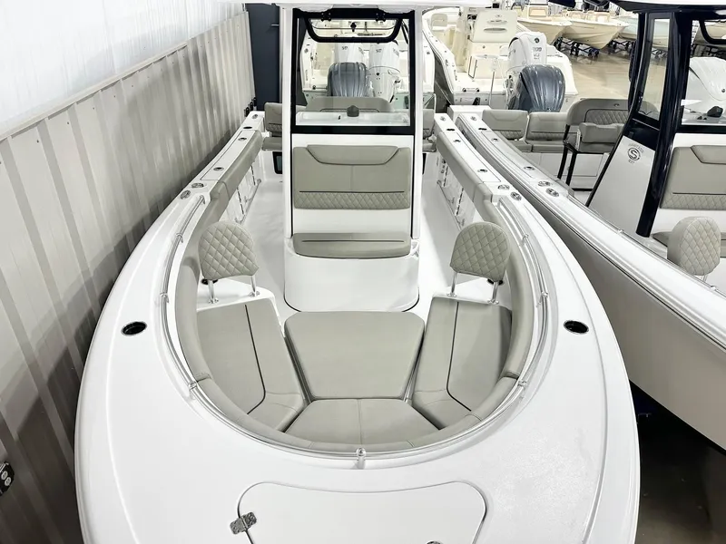 Slide: The Image of 2025 Sportsman Heritage 231 Center Console boat with spacious seating and modern design. - 7