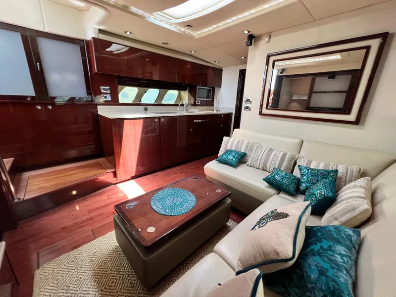 Slide: The Image of Luxurious interior of 2010 Sea Ray 540 Sundancer yacht with elegant seating and modern kitchen. - 20