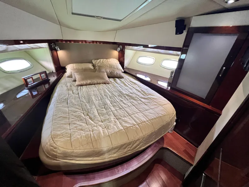 Slide: The Image of Luxurious cabin interior of 2010 Sea Ray 540 Sundancer yacht with elegant bedding. - 25