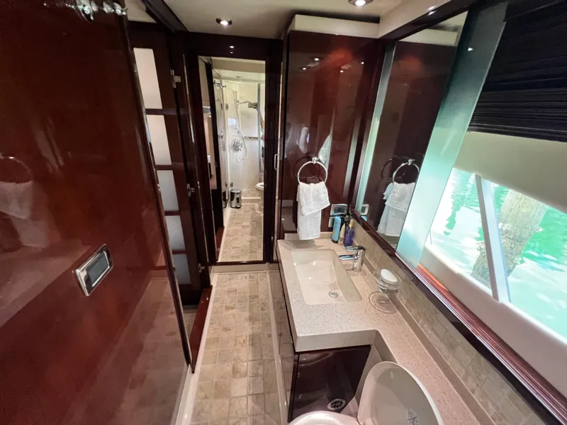 Slide: The Image of Luxurious bathroom interior of 2010 Sea Ray 540 Sundancer yacht with elegant wood finishes. - 27