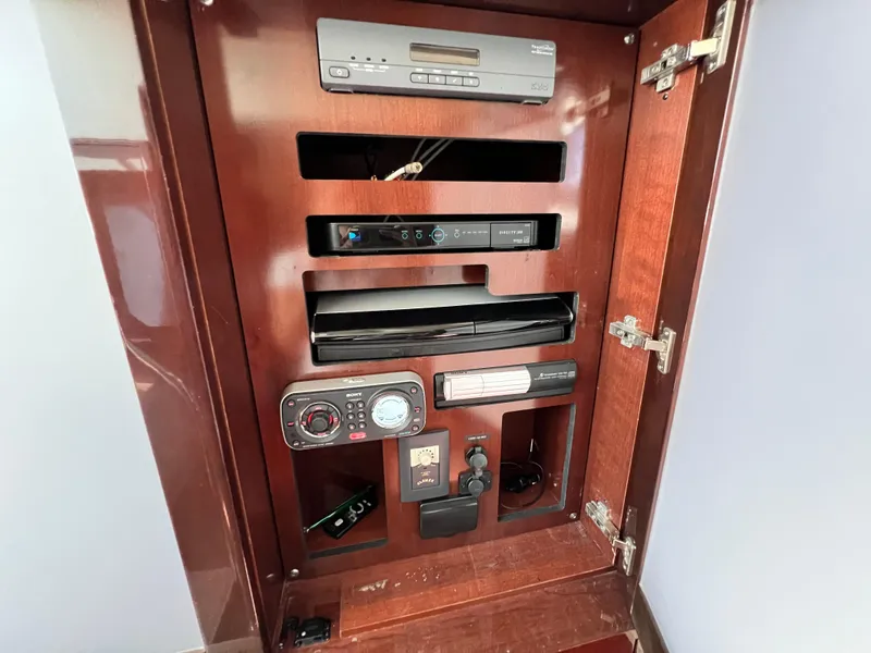 Slide: The Image of Entertainment system cabinet on a 2010 Sea Ray 540 Sundancer yacht. - 32