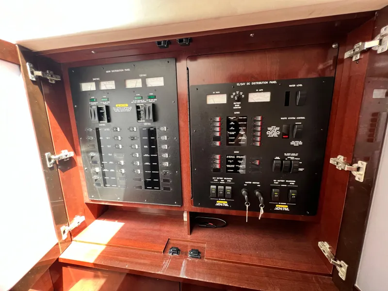 Slide: The Image of Electrical control panel inside 2010 Sea Ray 540 Sundancer yacht, featuring switches and circuit breakers. - 33