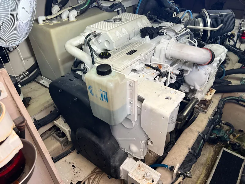 Slide: The Image of Engine compartment of a 2010 Sea Ray 540 Sundancer boat, showcasing mechanical components. - 36