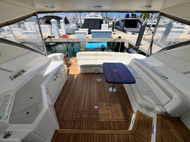 Slide: The Image of Luxurious 2010 Sea Ray 540 Sundancer yacht interior with elegant seating and wooden flooring. - 8