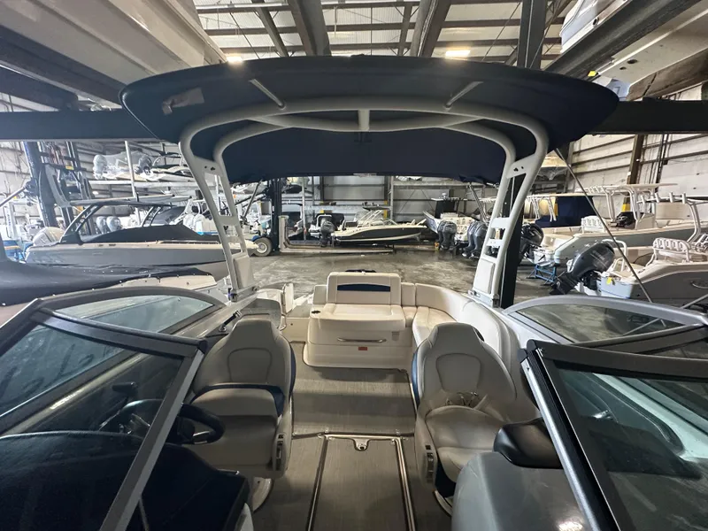 Slide: The Image of 2018 Chaparral 244 Sunesta boat interior in a storage facility. - 22