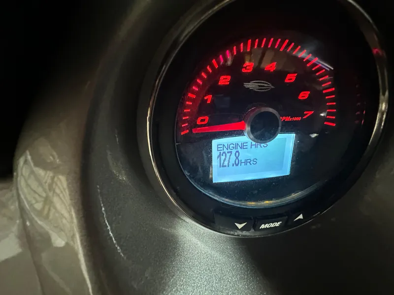 Slide: The Image of Close-up of 2018 Chaparral 244 Sunesta tachometer showing 127.8 engine hours. - 32