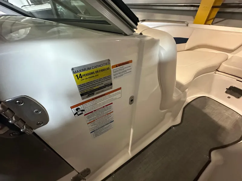 Slide: The Image of 2018 Chaparral 244 Sunesta boat interior with capacity label for 14 persons. - 35