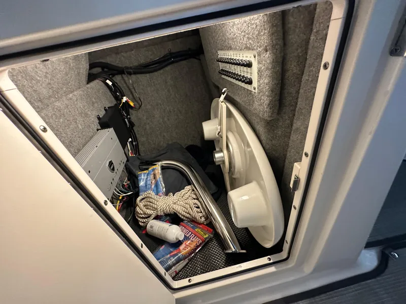 Slide: The Image of Storage compartment of 2018 Chaparral 244 Sunesta boat with equipment and accessories. - 44
