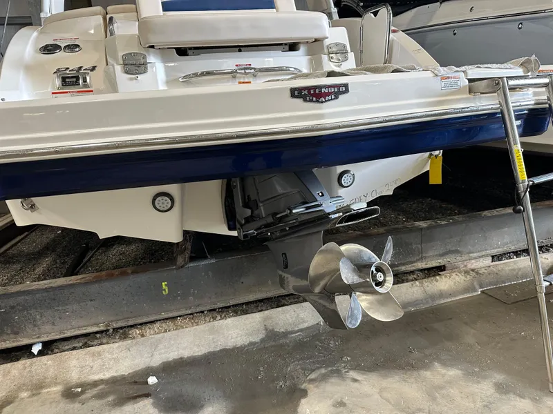 Slide: The Image of 2018 Chaparral 244 Sunesta boat stern with propeller in storage. - 49