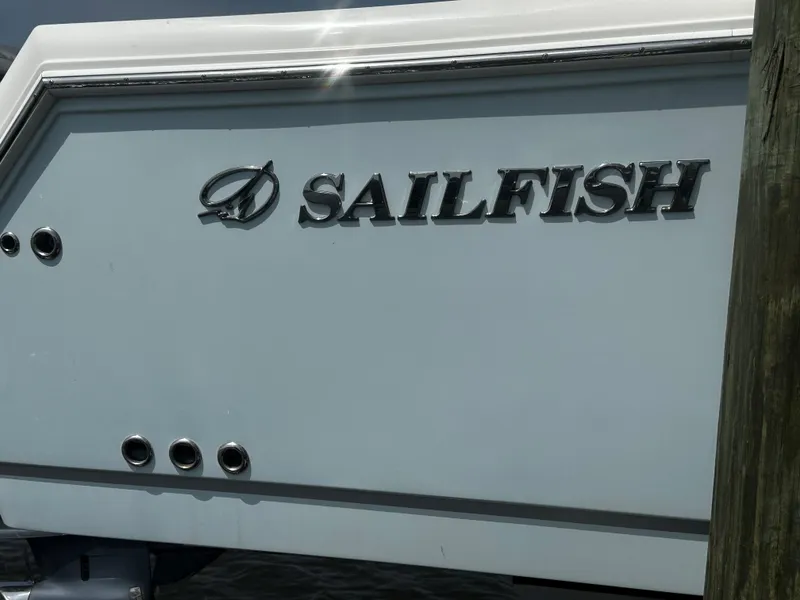 Slide: The Image of 2019 Sailfish 290cc boat, close-up of logo on the hull. - 17