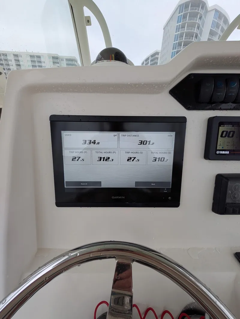 Slide: The Image of 2019 Sailfish 290cc dashboard with Garmin display, showing navigation and performance data. - 6
