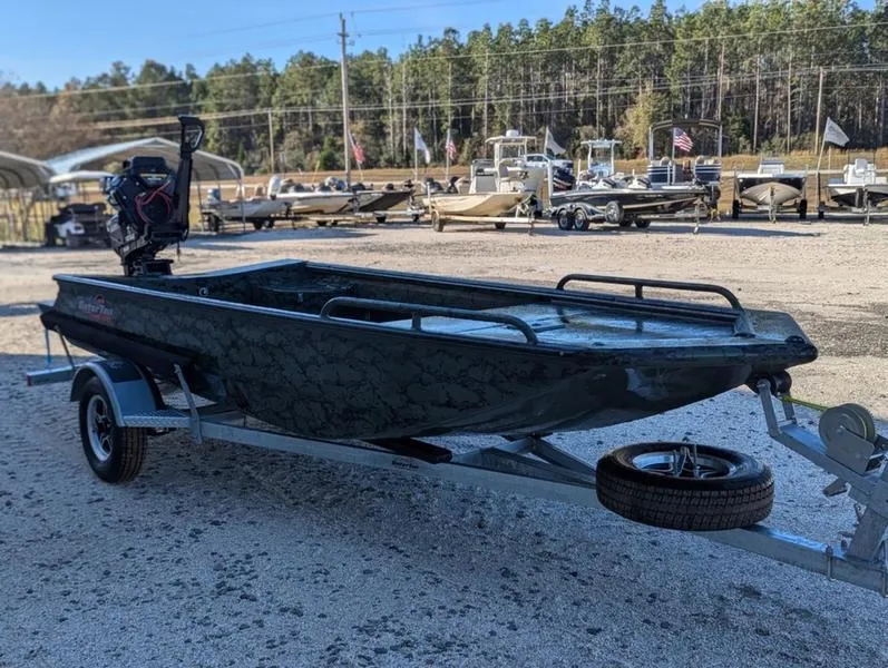 Slide: The Image of 2025 Gator Tail 1750 Savage Series boat on trailer, parked outdoors. - 1