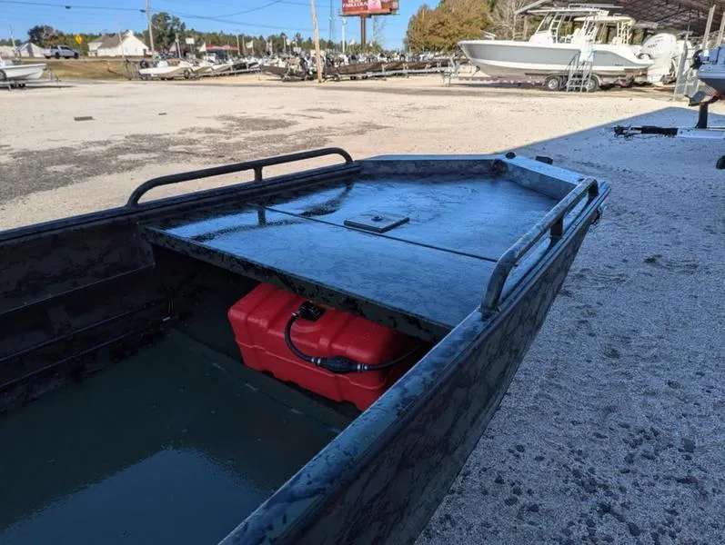 Slide: The Image of 2025 Gator Tail 1750 Savage Series boat with red fuel tank, parked outdoors. - 8
