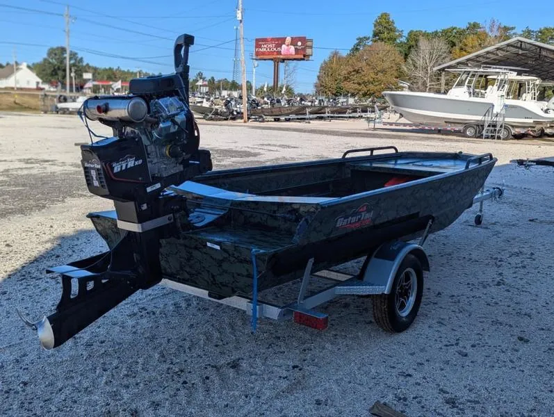 Slide: The Image of 2025 Gator Tail 1750 Savage Series boat on trailer in outdoor setting. - 9