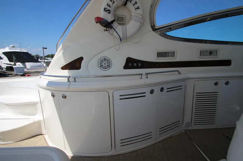 Slide: The Image of 2003 Sea Ray 550 Sundancer yacht interior with storage cabinets and sleek design. - 15