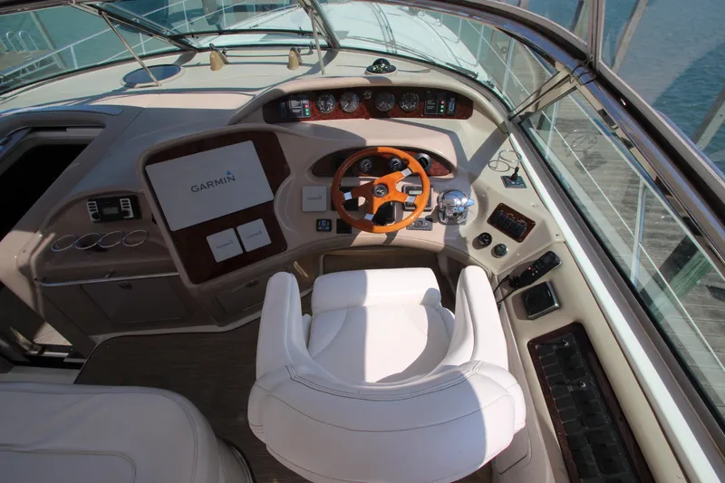 Slide: The Image of Cockpit of 2003 Sea Ray 550 Sundancer with Garmin navigation and leather seating. - 24