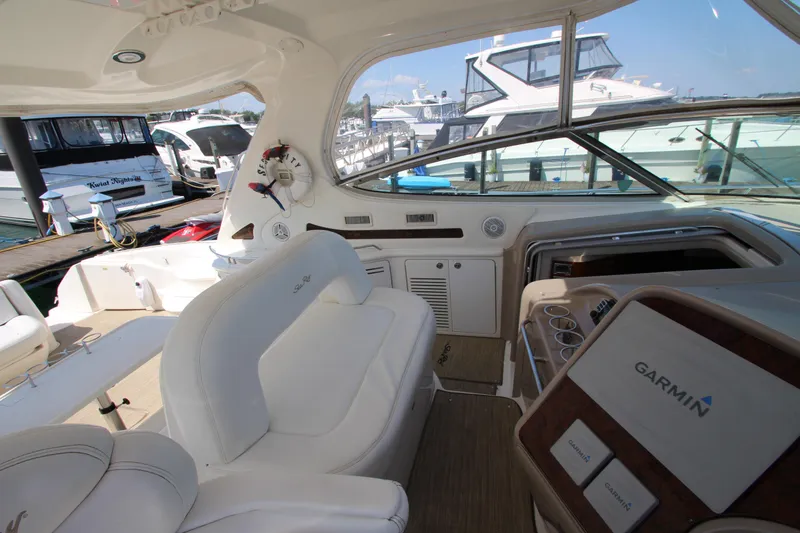 Slide: The Image of 2003 Sea Ray 550 Sundancer yacht interior with Garmin navigation, docked at marina. - 30