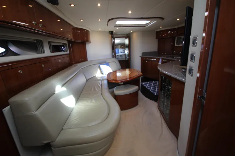 Slide: The Image of Luxurious interior of 2003 Sea Ray 550 Sundancer yacht with leather seating and wood finishes. - 33