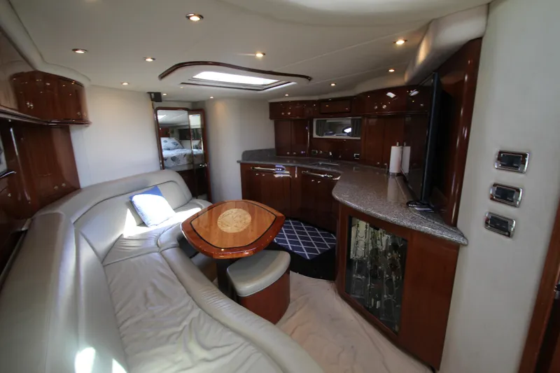 Slide: The Image of Luxurious interior of 2003 Sea Ray 550 Sundancer yacht with elegant seating and modern amenities. - 35