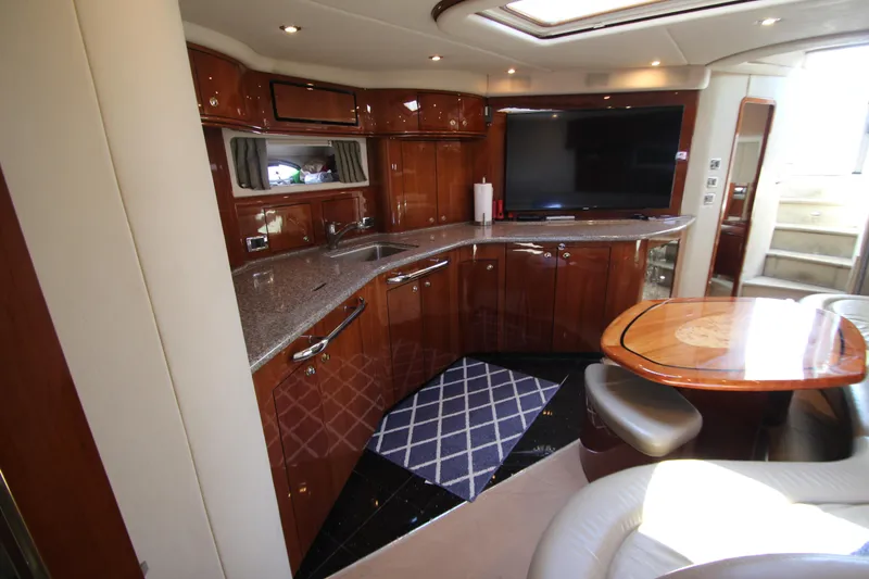 Slide: The Image of Luxurious interior of 2003 Sea Ray 550 Sundancer yacht with elegant wood cabinetry. - 37