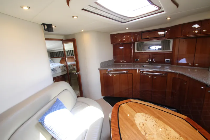Slide: The Image of Luxurious interior of 2003 Sea Ray 550 Sundancer yacht with elegant wood finishes. - 41