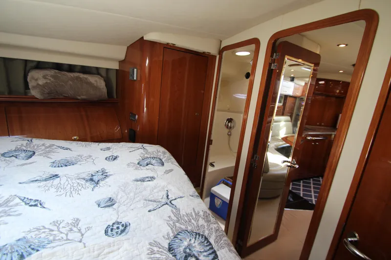 Slide: The Image of Interior of 2003 Sea Ray 550 Sundancer yacht with cozy bedroom and elegant wood finishes. - 46