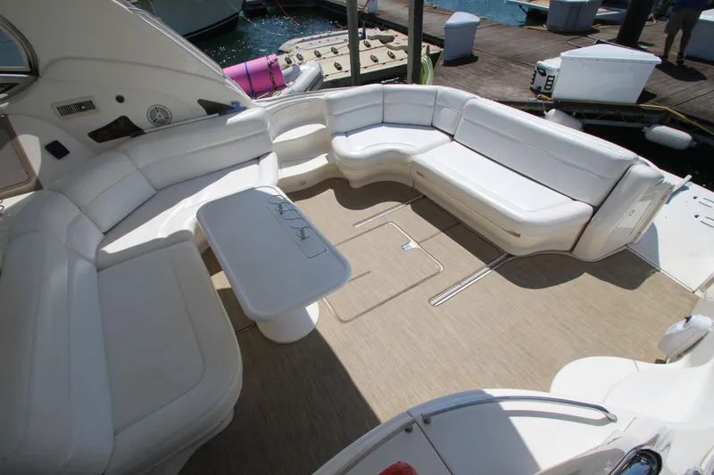 Slide: The Image of Luxurious 2003 Sea Ray 550 Sundancer yacht with spacious white seating area. - 5