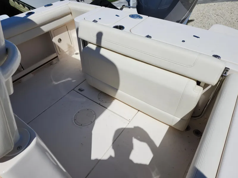 Slide: The Image of 2021 Grady-White Fisherman 236 boat interior with foldable seating and storage. - 11