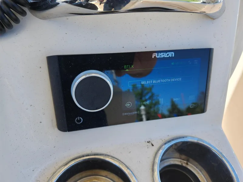 Slide: The Image of Fusion Bluetooth device on 2021 Grady-White Fisherman 236 boat dashboard. - 14
