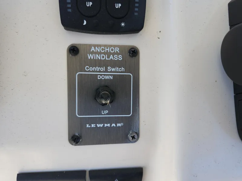 Slide: The Image of Anchor windlass control switch on 2021 Grady-White Fisherman 236 boat. - 15