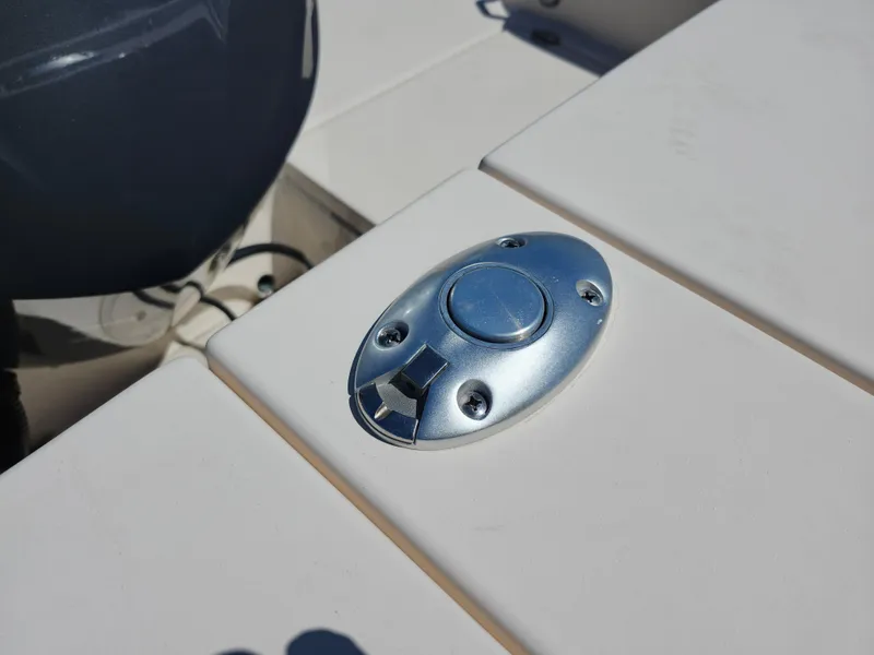 Slide: The Image of Chrome latch on 2021 Grady-White Fisherman 236 boat deck. - 18