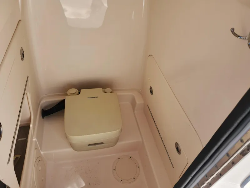 Slide: The Image of 2021 Grady-White Fisherman 236 boat interior with portable toilet. - 21