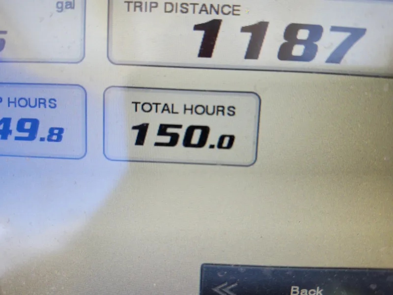 Slide: The Image of Display screen showing 2021 Grady-White Fisherman 236 with 150 total hours and 1187 trip distance. - 22