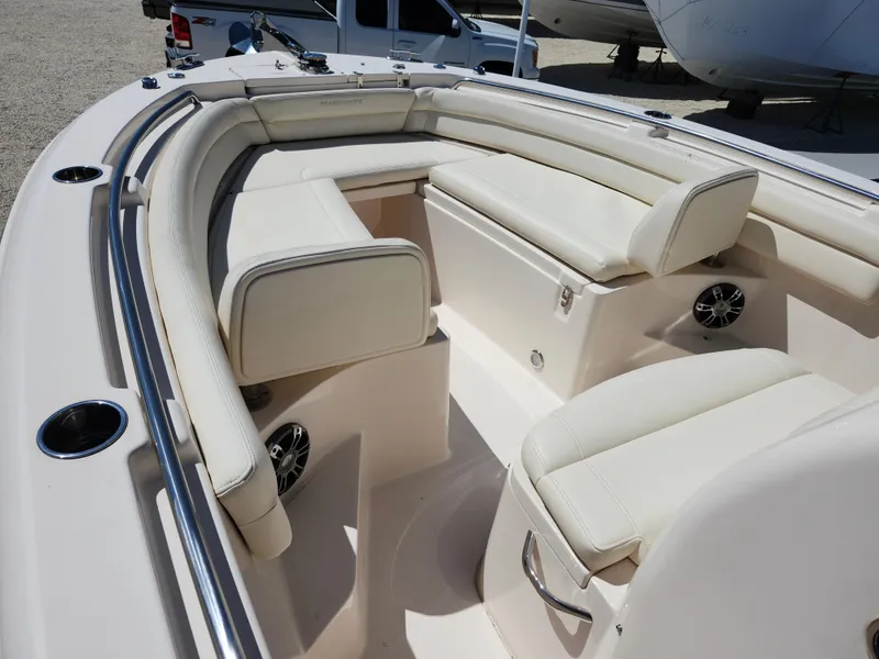 Slide: The Image of 2021 Grady-White Fisherman 236 boat interior with cushioned seating and cup holders. - 3