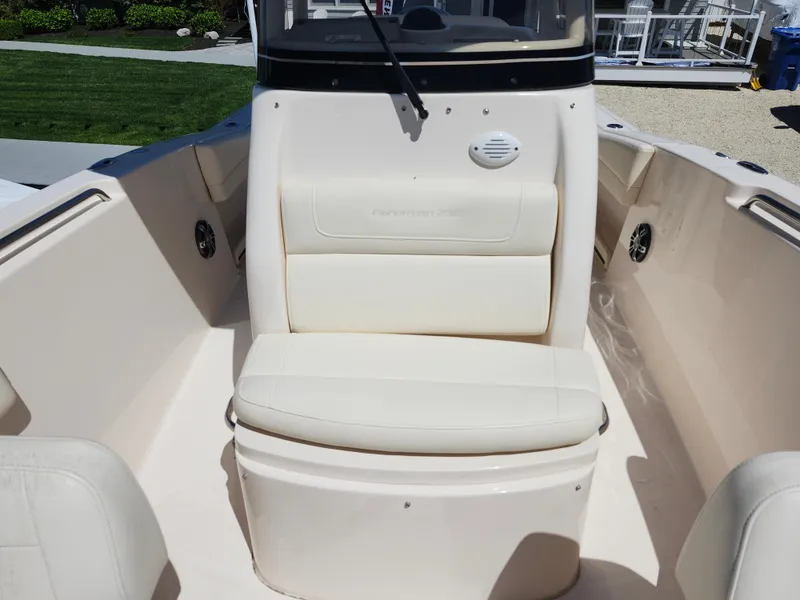 Slide: The Image of 2021 Grady-White Fisherman 236 boat interior with cushioned seating and console. - 4