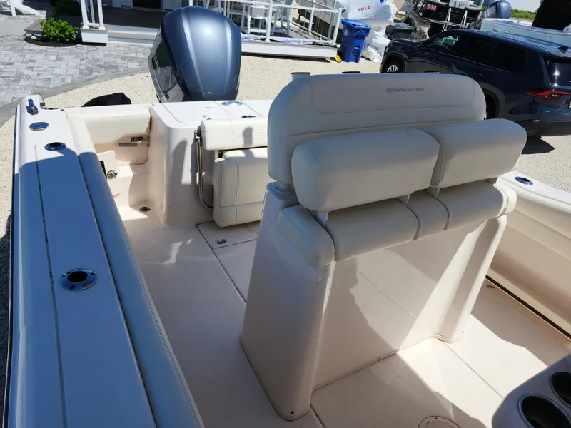 Slide: The Image of 2021 Grady-White Fisherman 236 boat interior with seating and engine view. - 8
