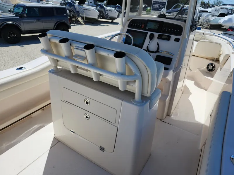 Slide: The Image of 2021 Grady-White Fisherman 236 boat interior with rod holders and control panel. - 9