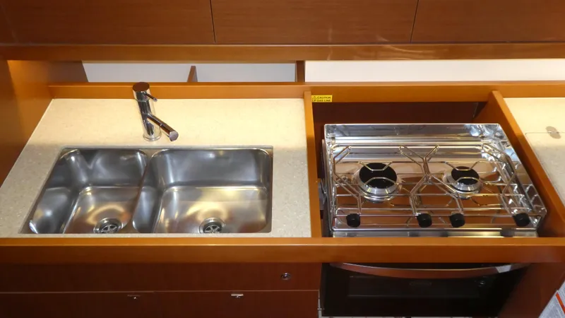 Slide: The Image of Galley kitchen in 2014 Beneteau Oceanis 41 yacht with dual sink and stove. - 17