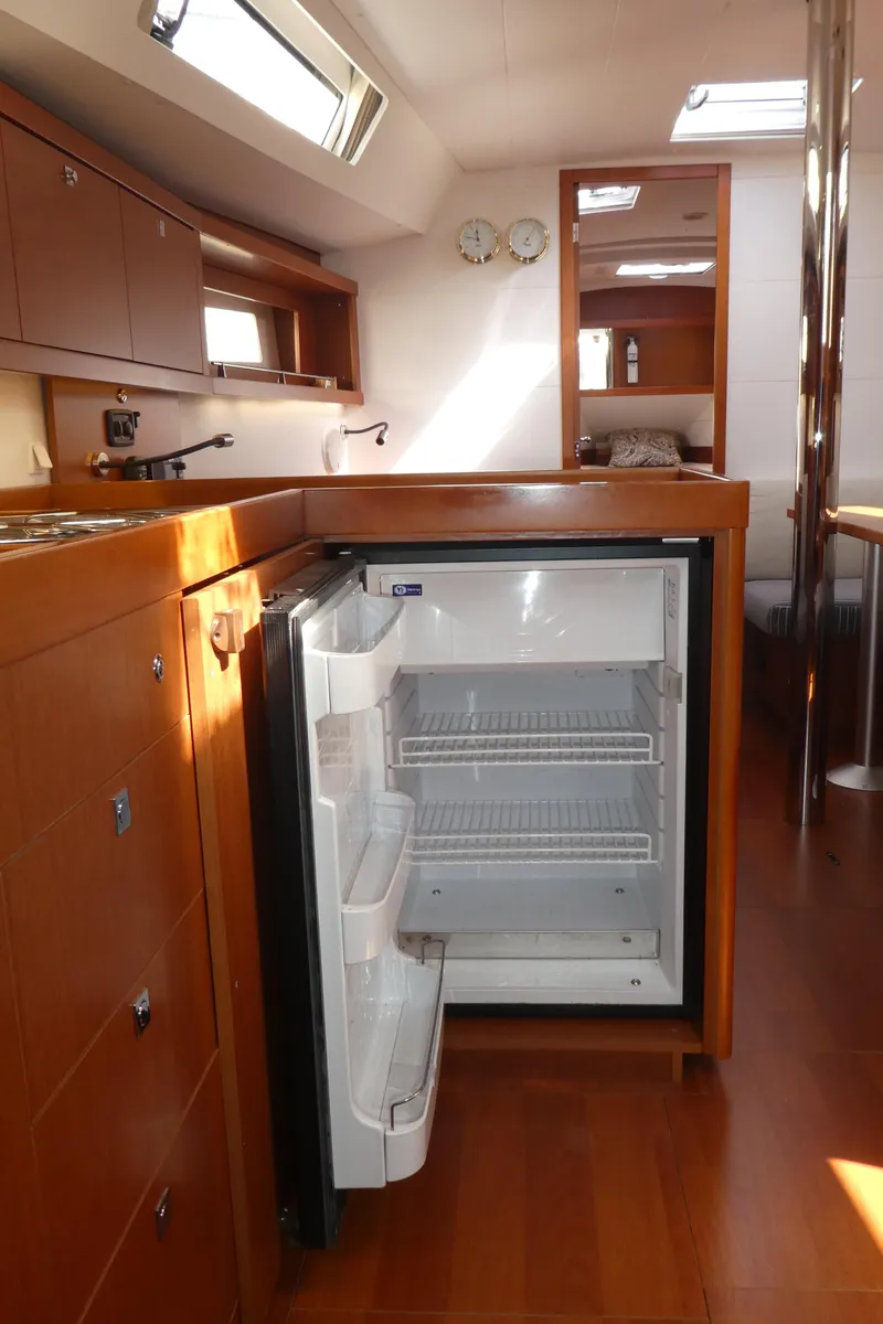 Slide: The Image of Interior of 2014 Beneteau Oceanis 41 yacht with open fridge in the galley. - 18