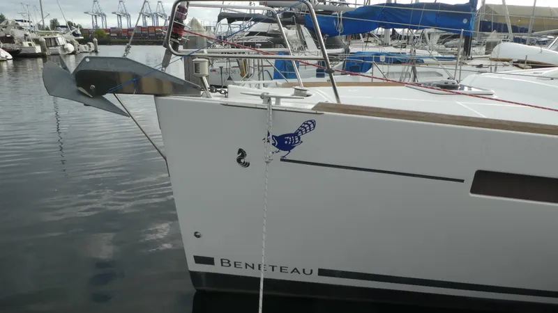 Slide: The Image of 2014 Beneteau Oceanis 41 sailboat docked in marina, featuring sleek design and modern amenities. - 2