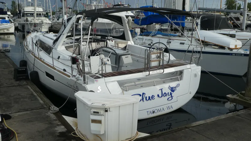 Slide: The Image of Beneteau Oceanis 41 sailboat docked at marina, 2014 model, named "Blue Jay". - 3