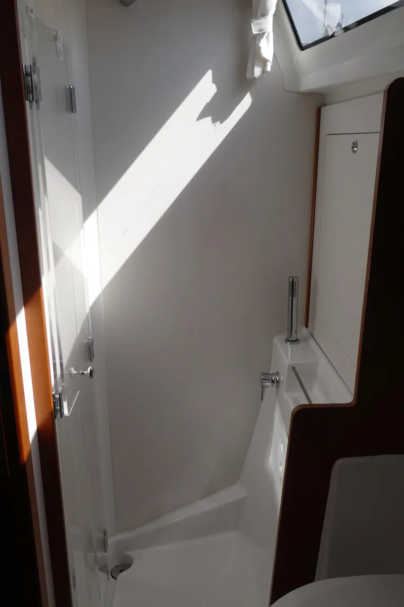 Slide: The Image of Interior of 2014 Beneteau Oceanis 41 sailboat, featuring a sleek, modern bathroom design. - 32