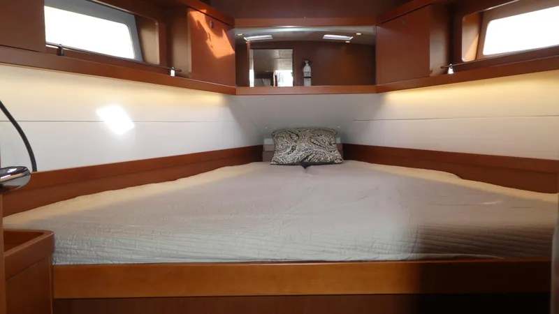 Slide: The Image of Cabin interior of 2014 Beneteau Oceanis 41 sailboat with cozy bed and wooden finish. - 39