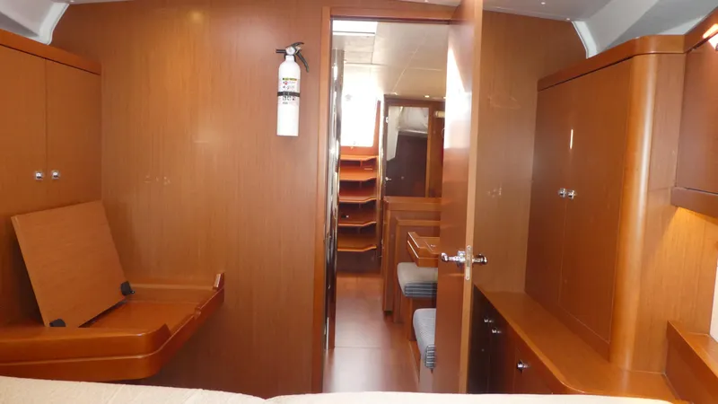 Slide: The Image of Interior of 2014 Beneteau Oceanis 41 yacht with wooden cabinetry and seating. - 41