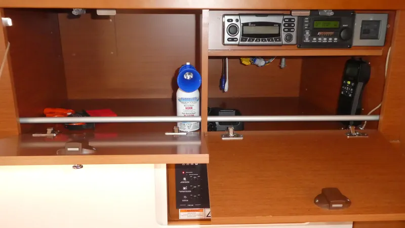 Slide: The Image of Navigation station on 2014 Beneteau Oceanis 41 yacht with radio equipment and storage. - 43