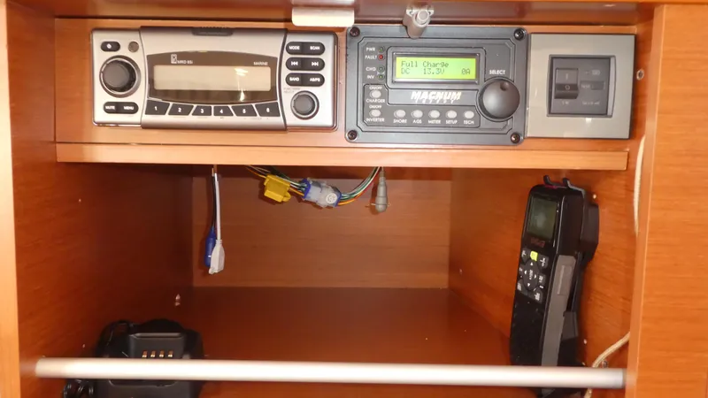 Slide: The Image of Control panel of a 2014 Beneteau Oceanis 41 sailboat with radio and navigation equipment. - 44
