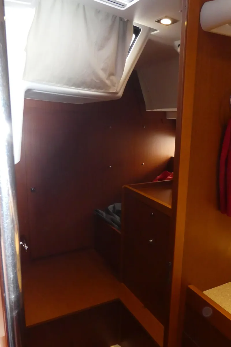 Slide: The Image of Interior cabin of 2014 Beneteau Oceanis 41 sailboat, featuring wooden finishes and natural light. - 47