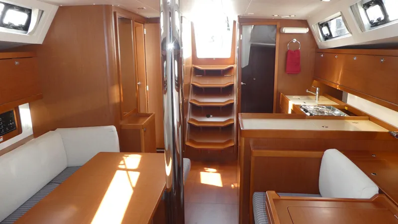 Slide: The Image of Interior of 2014 Beneteau Oceanis 41 sailboat with wood finish and modern amenities. - 6
