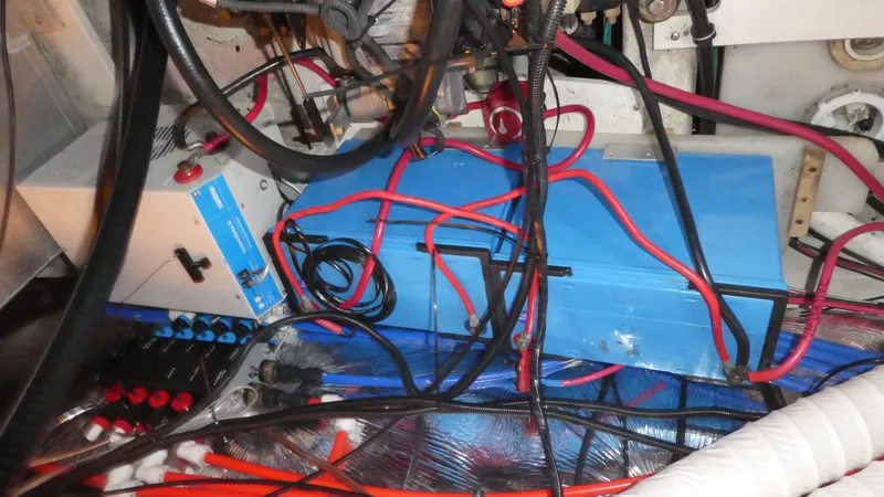 Slide: The Image of Engine compartment of a 2004 Larson 370 boat with wiring and components. - 31